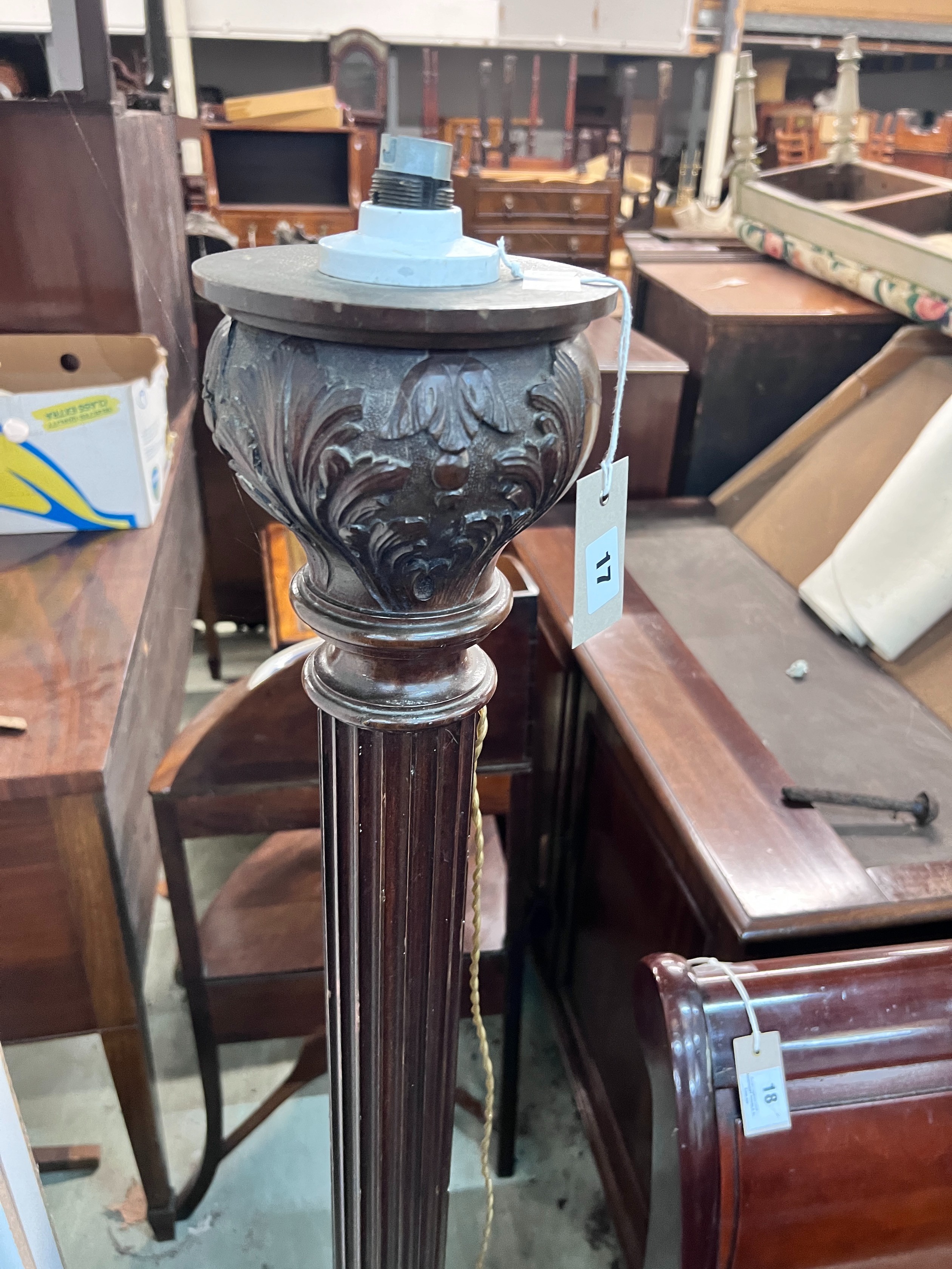 A carved oak and mahogany carved standard lamp, height 151cm *Please note the sale commences at 9am.